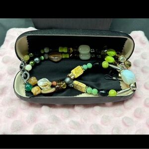 Handcrafted by Evi Vaucher de la Croix..genuine stones hold your glasses